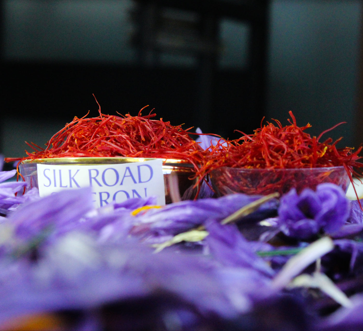 Deep-red saffron threads displayed with purple saffron crocus flowers